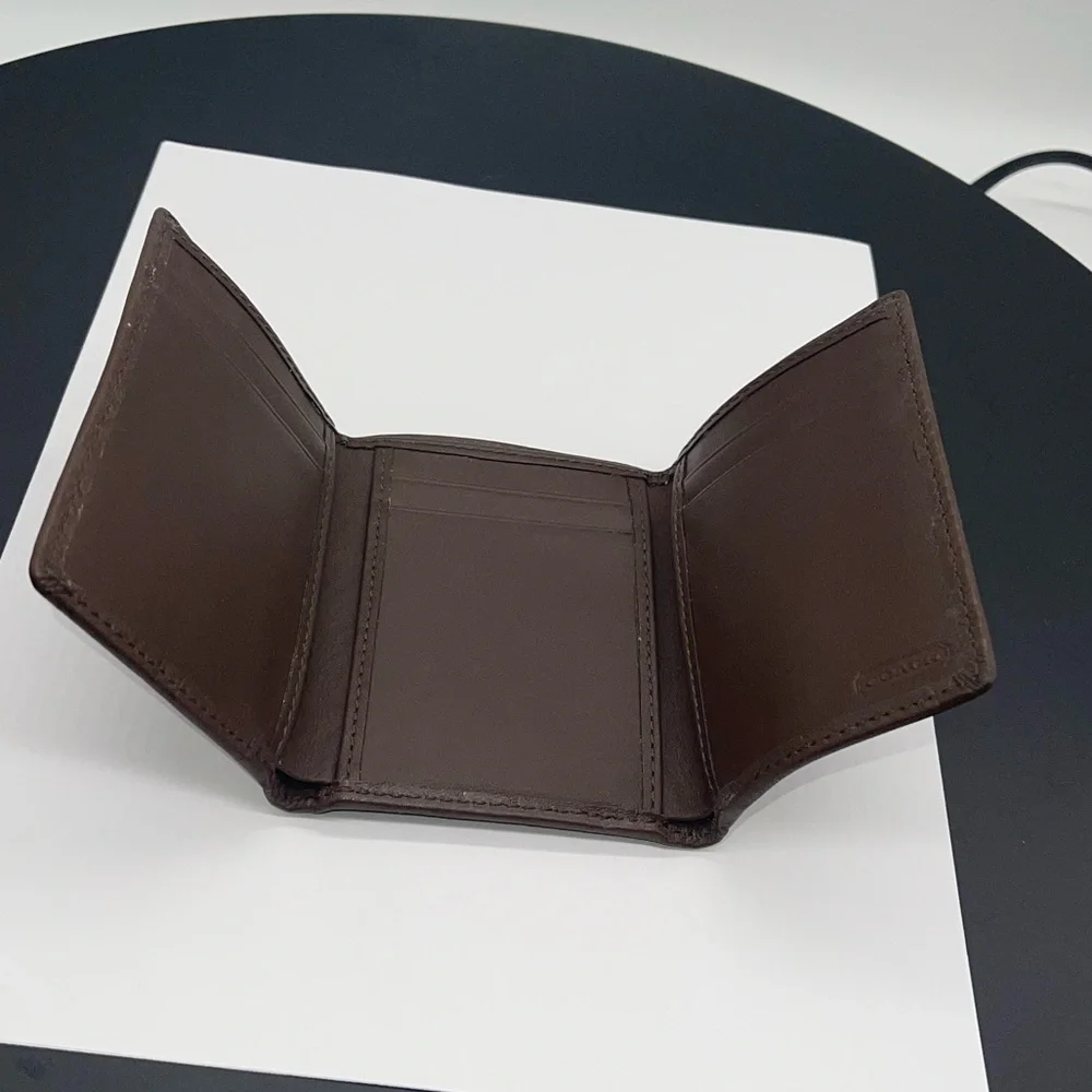 Coach Signature Embossed Trifold Wallet